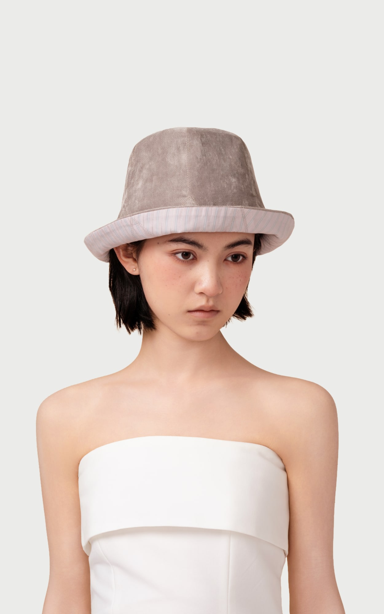 Duality Reversible Bucket Hat worn by a model