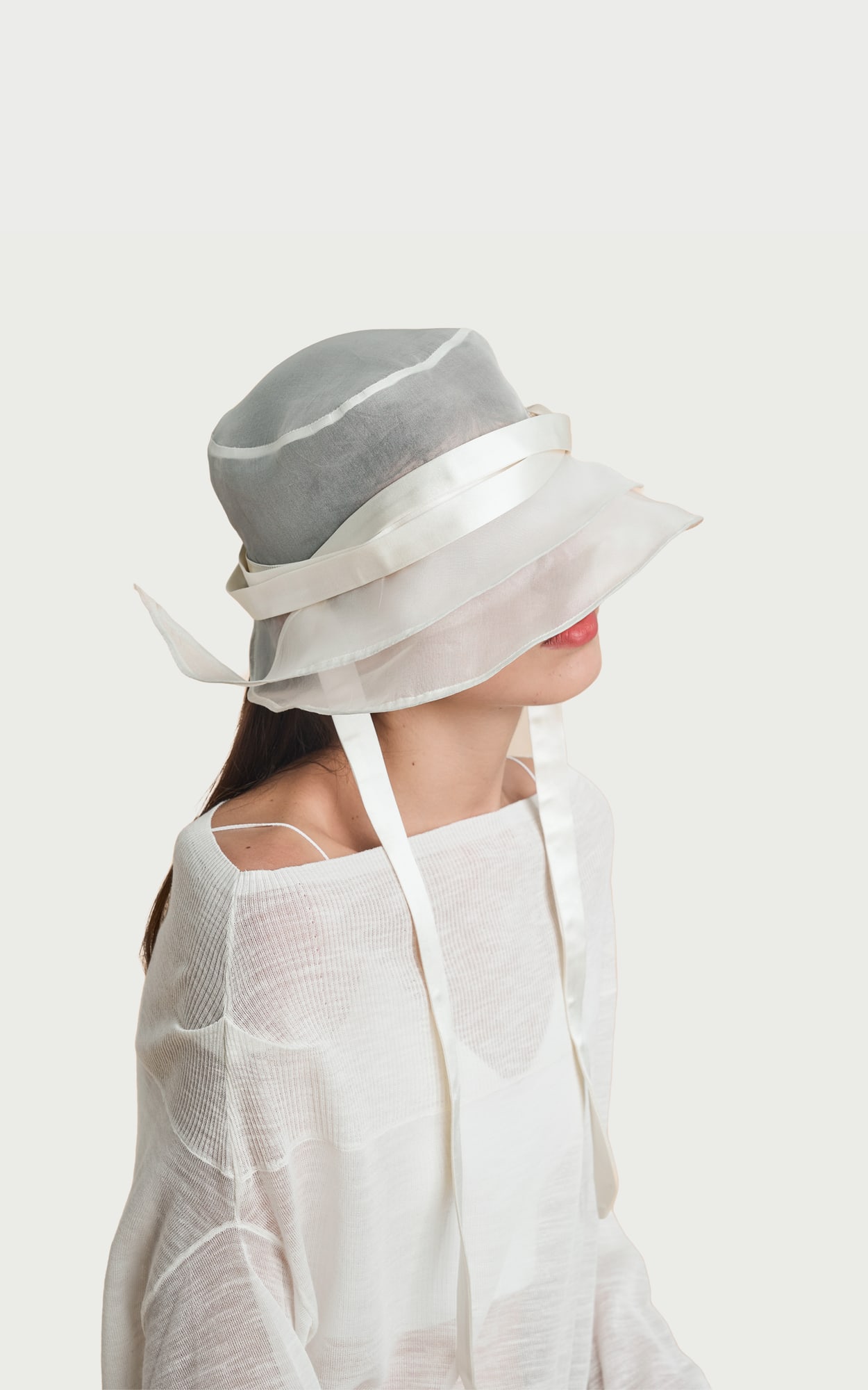 The Growth Collection Airy Veil Hat worn by a model
