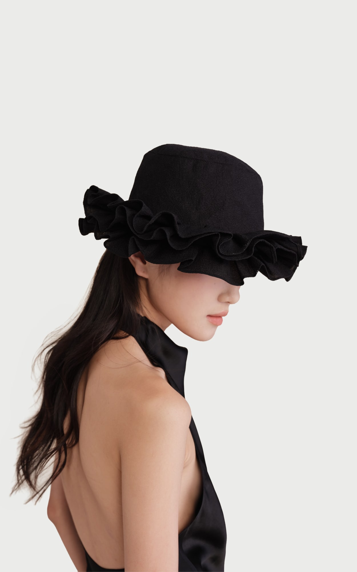 The Growth Collection Petal Brim Hat worn by a model