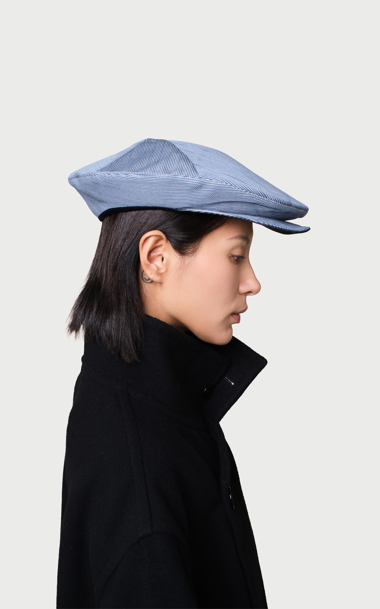 Neo Order Pleated Foldable Hat worn by a model